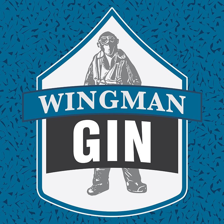 front label of the Wingman Gin with a illustration of world war two US fighter pilot behind the name on chevron shape frame, dedicated to the the US Air Force